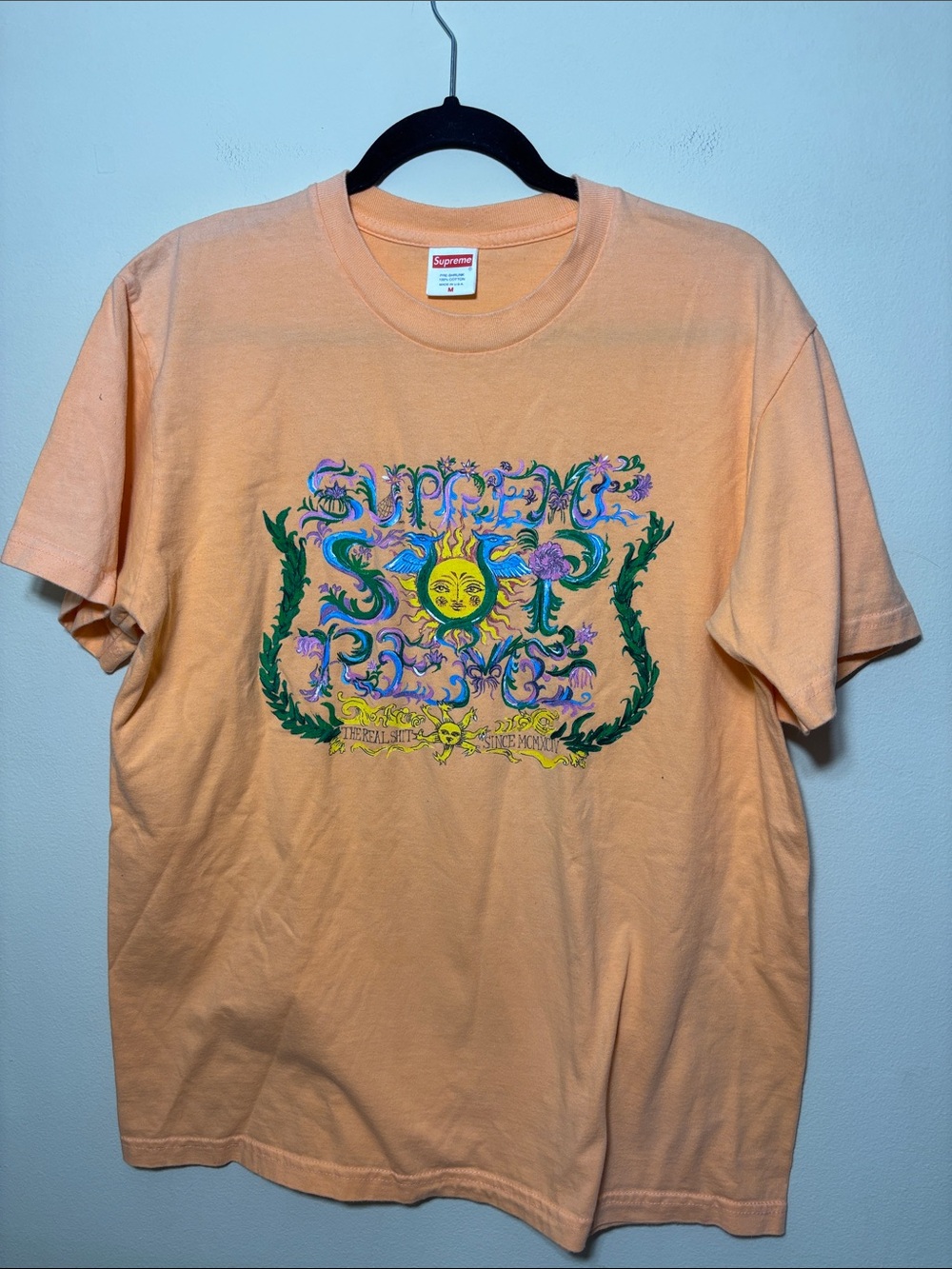 Supreme Peach Tee with Colorful Sun Graphic